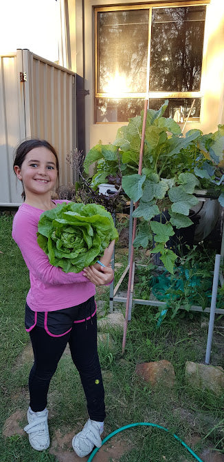 Lexia with a bowl of fresh home-grown salad