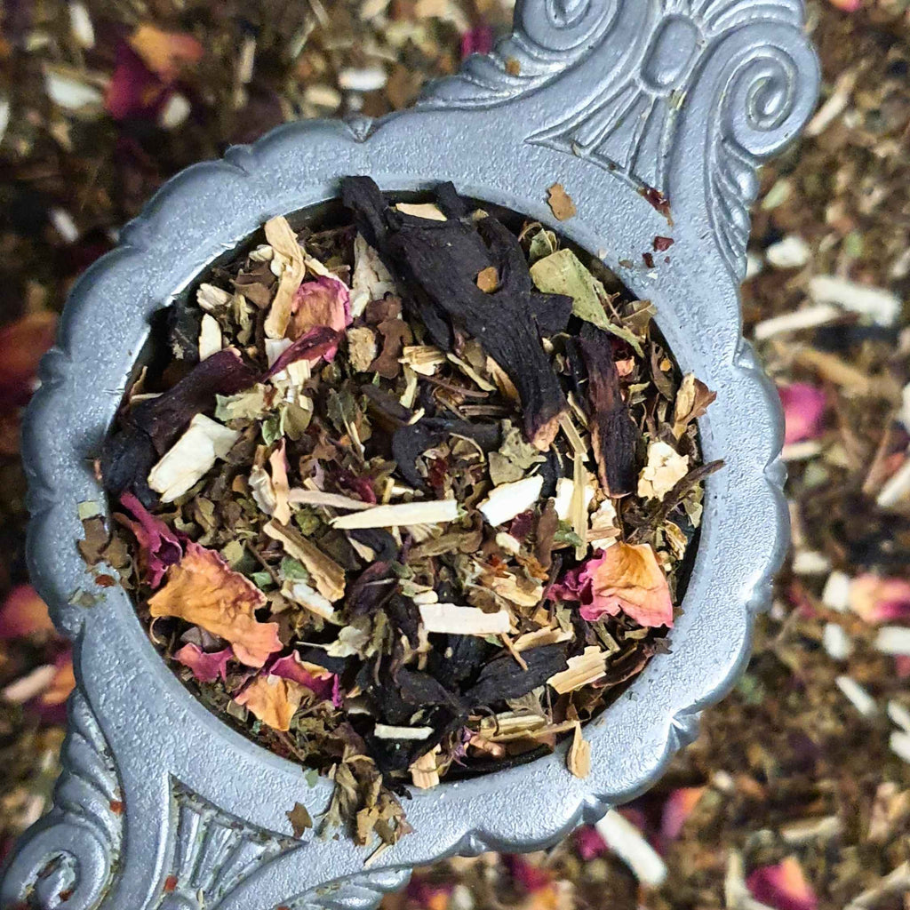 Exhale tea blend herbs in a strainer